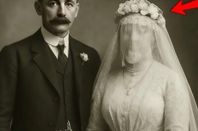 This 1912 wedding photo looked like a perfect celebration of love — a bride smiling under her delicate veil, ready to start a new life. But when viewers looked closer, the veil hid a shocking detail that no one expected…